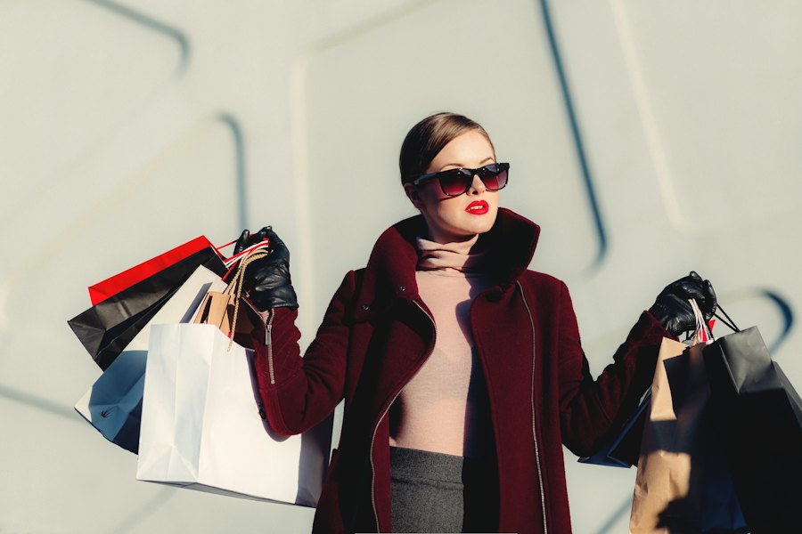 Burgundy wool-blend overcoat with a high collar, worn over a blush turtleneck