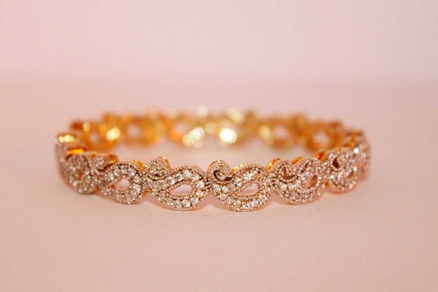 Ambi paisley bangle in gold set with small pavé diamonds